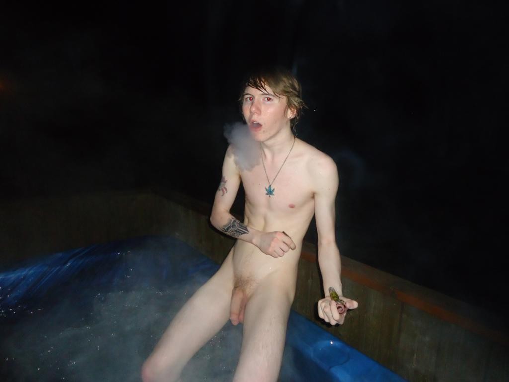 slim teen boy showing his hard cock in the water